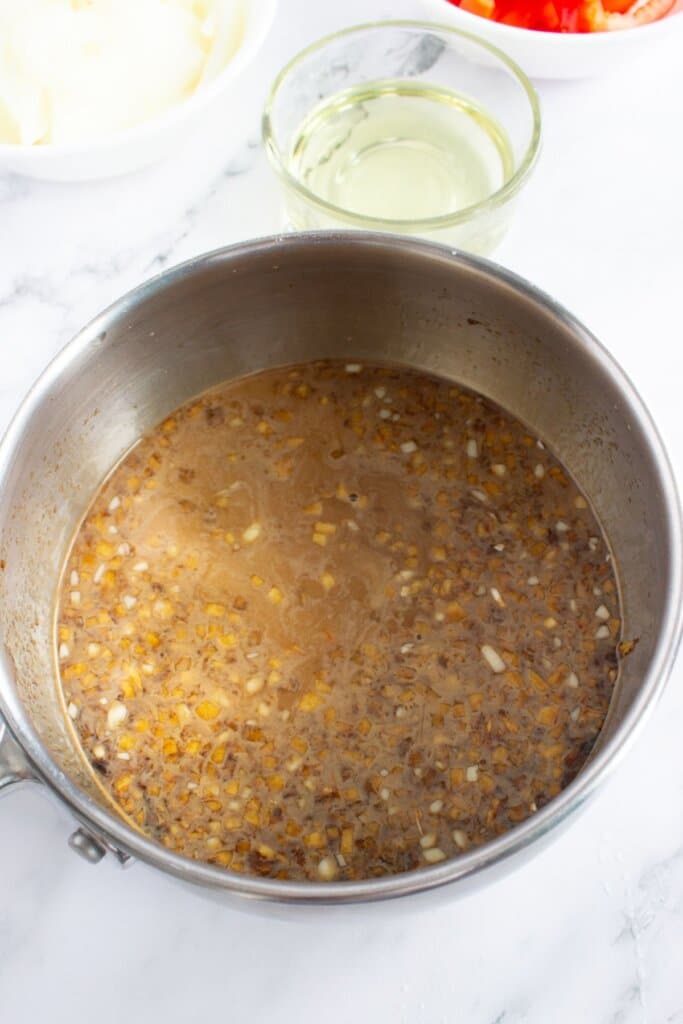 Sauce being cooked in a saucepan.