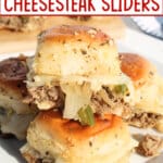 Philly cheesesteak sliders on a plate.
