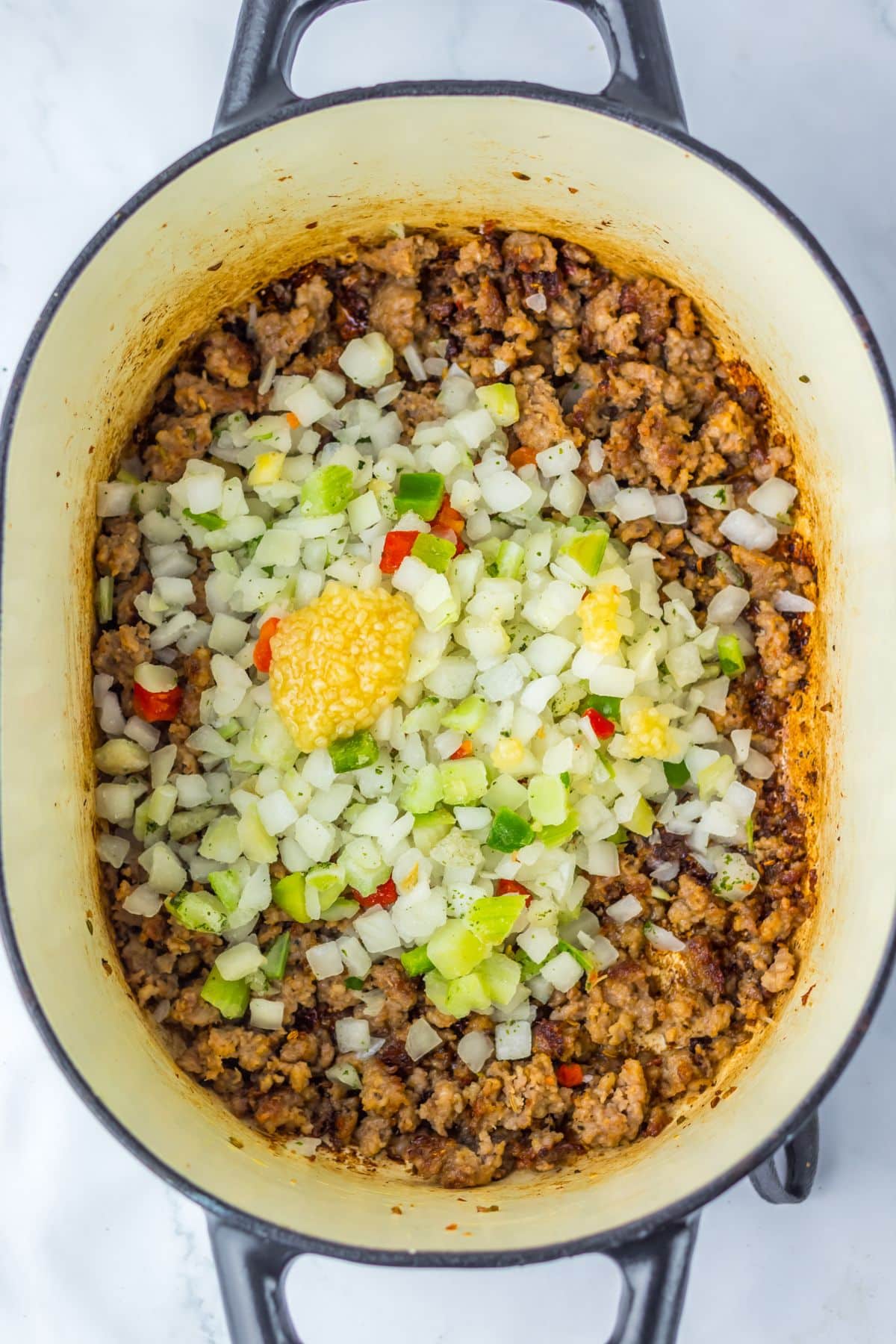 Sausage, veggies and garlic in a large pot.