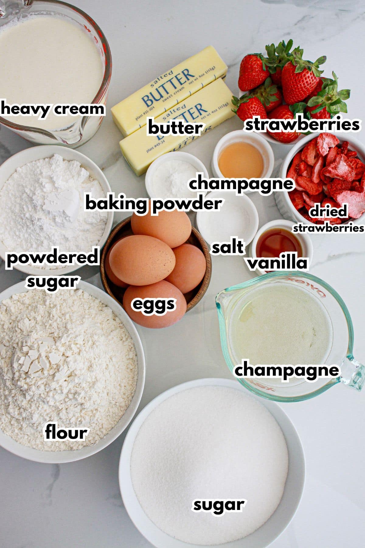 Ingredients for strawberry champagne cake on a counter.
