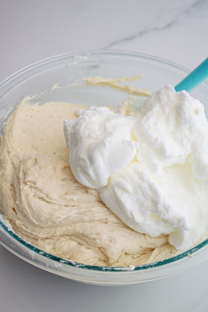Egg whites being folding into batter.