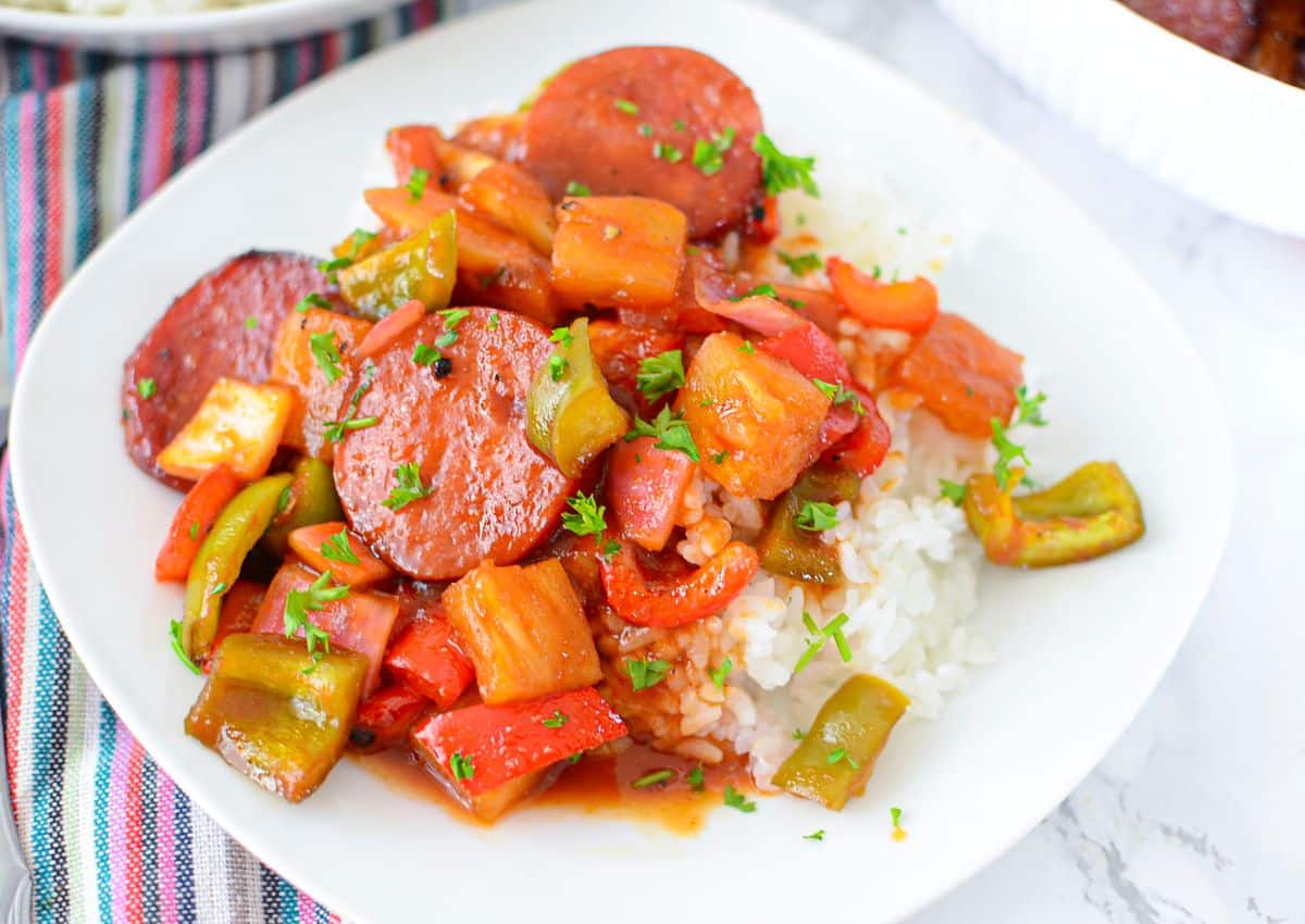 Plate full of sweet and sour kielbasa ready to serve.