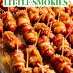 Bacon wrapped little smokies in a baking dish.