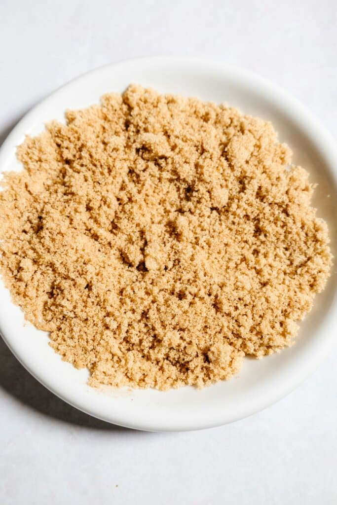 Brown sugar and seasoning on a plate.