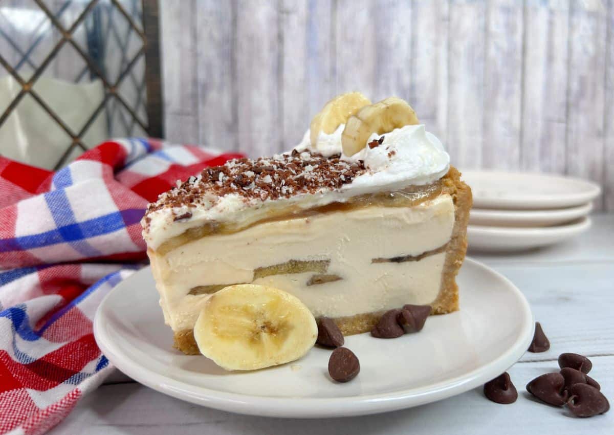 Slice of banoffee on a plate.
