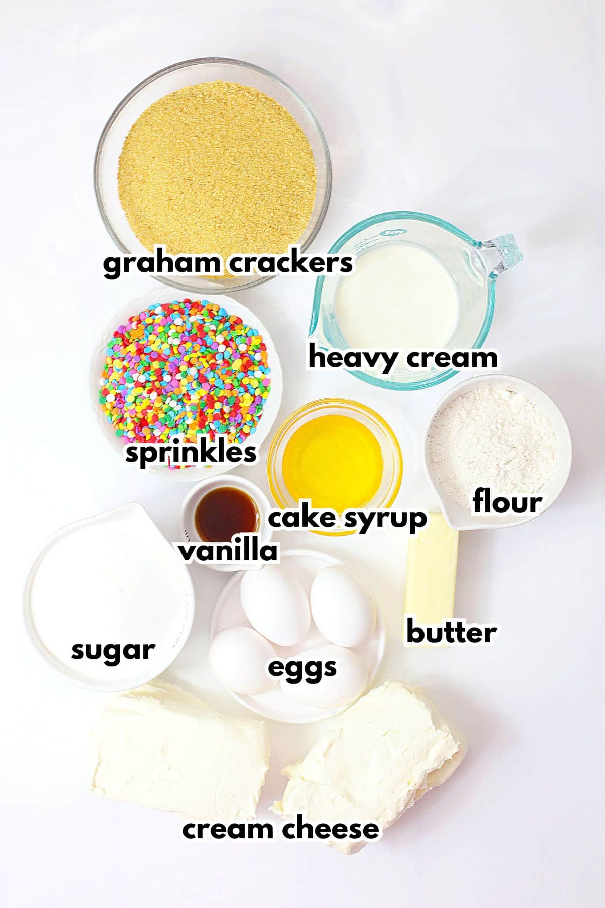Bowls of ingredients labeled with text on a counter.