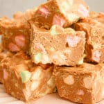 Butterscotch confetti squares on a cake plate.