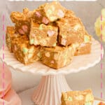 Butterscotch confetti squares on a cake plate.