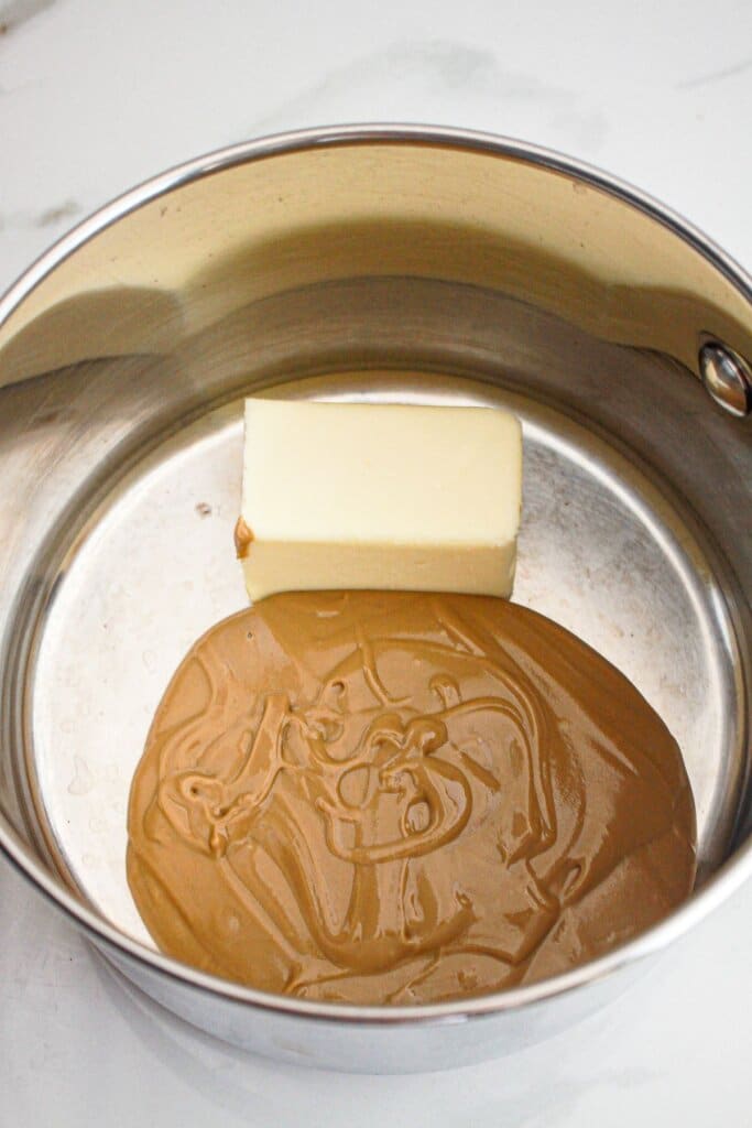 Butter and peanut butter in a saucepan.