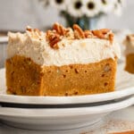 Slice of carrot cake blondie on a plate.