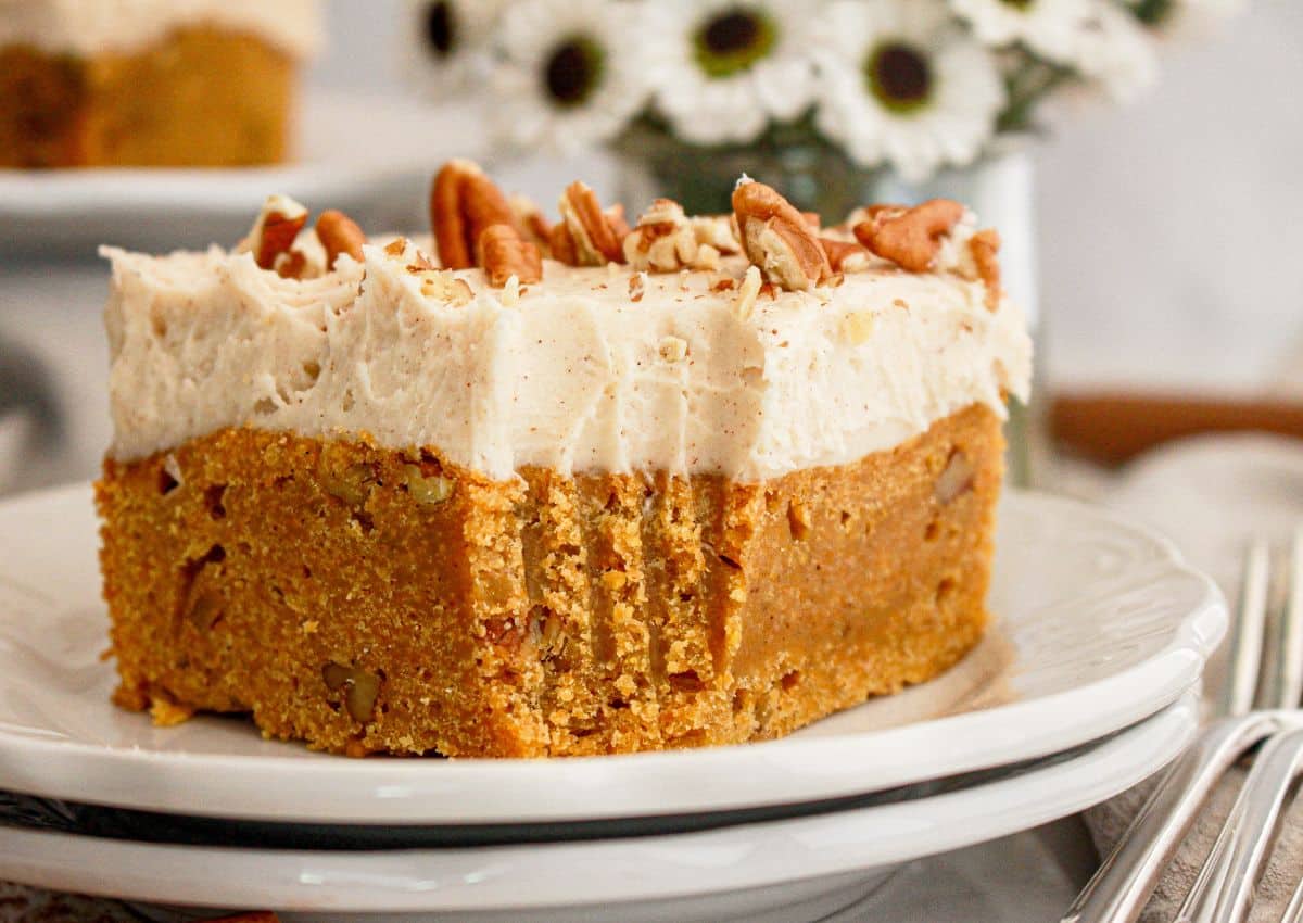 Slice of carrot cake blondie on a plate.