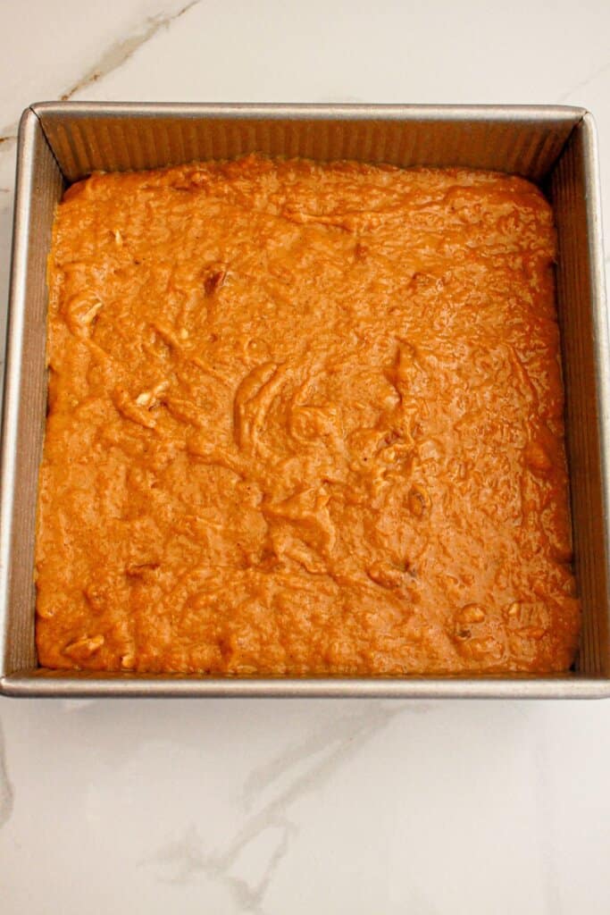 Batter spread in a baking dish ready for the oven.