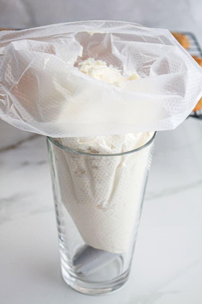 Cream cheese frosting in a piping bag.