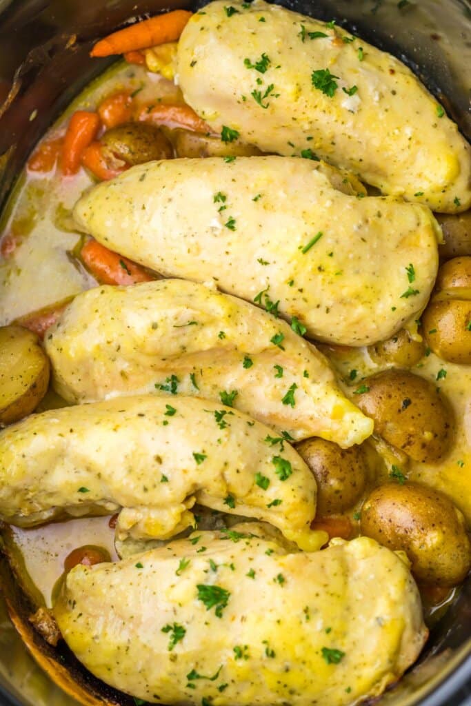 Slow cooker creamy ranch chicken in a crockpot.