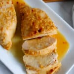 Honey garlic chicken breasts on a serving platter.