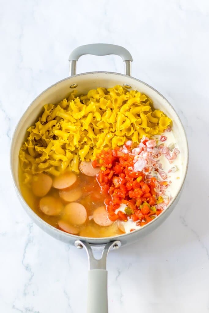 Ingredients for skillet meal being added to the skillet.