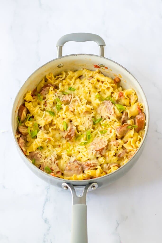 One pot sauasage pasta in a skillet.