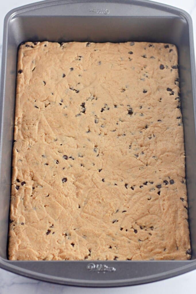 Peanut butter dough baked in a metal pan.