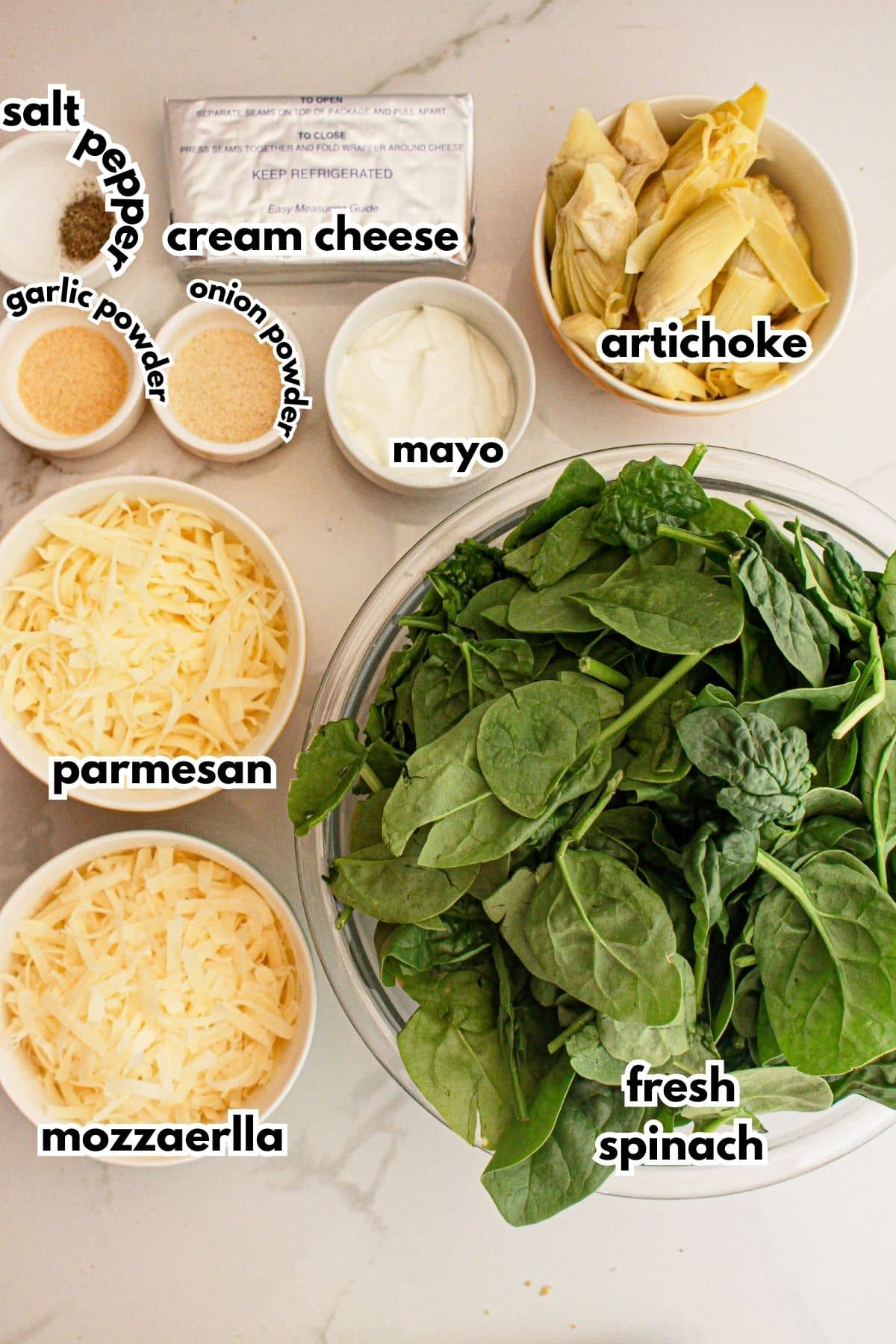 Ingredients for spinach dip on a counter.