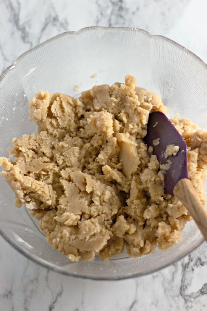 Crust being mixed in a large bowl.