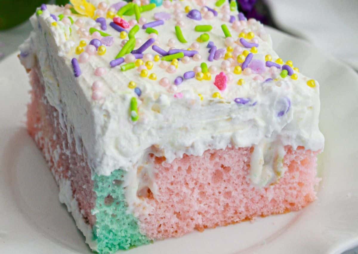 Slice of easter pastel cake on a small plate.