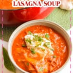 Bowl full of lasagna soup and topped with a ricotta and parmesan mixture.