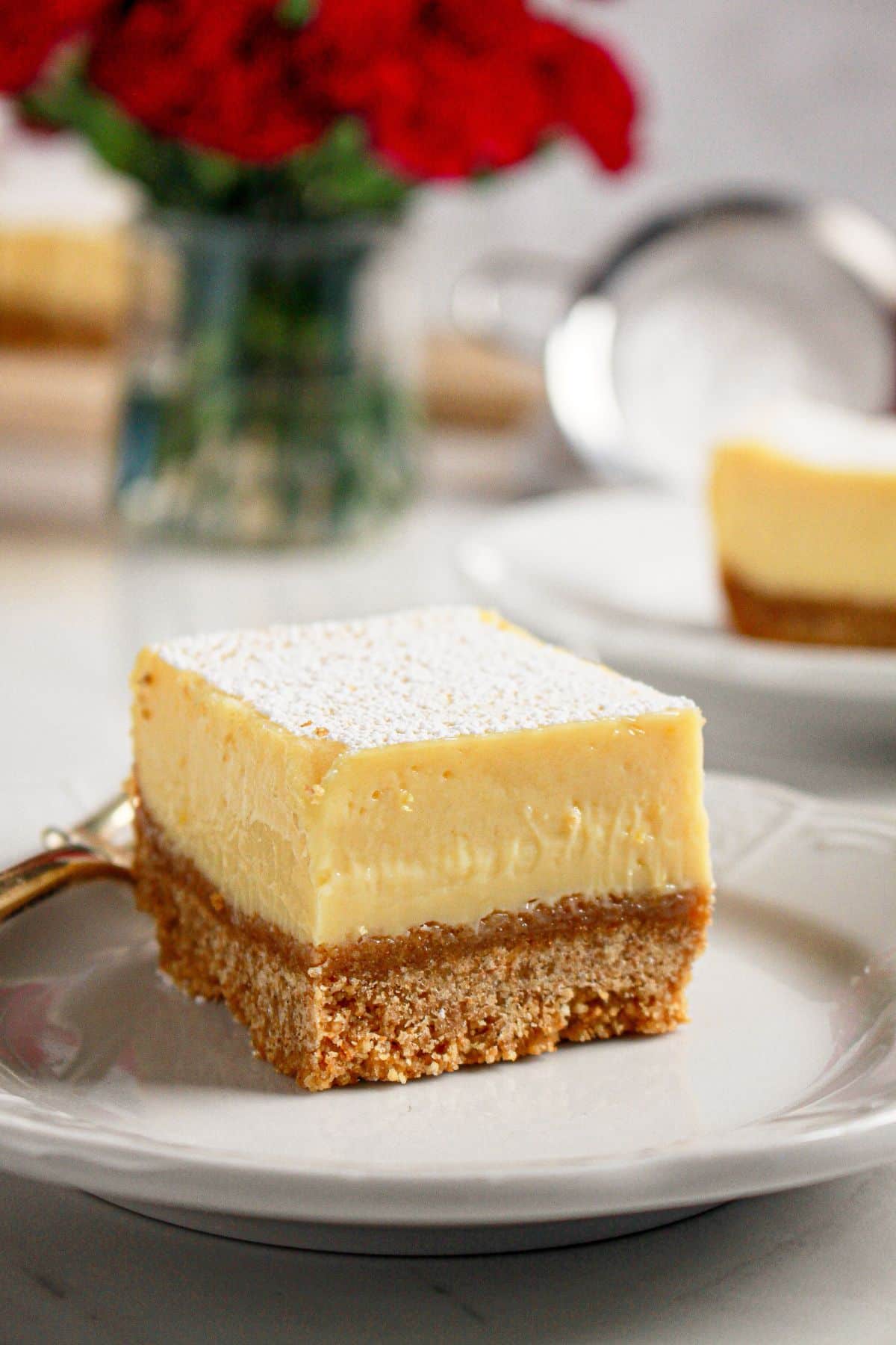 Slice of easy lemon bar on a small plate with a fork.