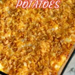 Funeral potatoes in a glass baking dish.