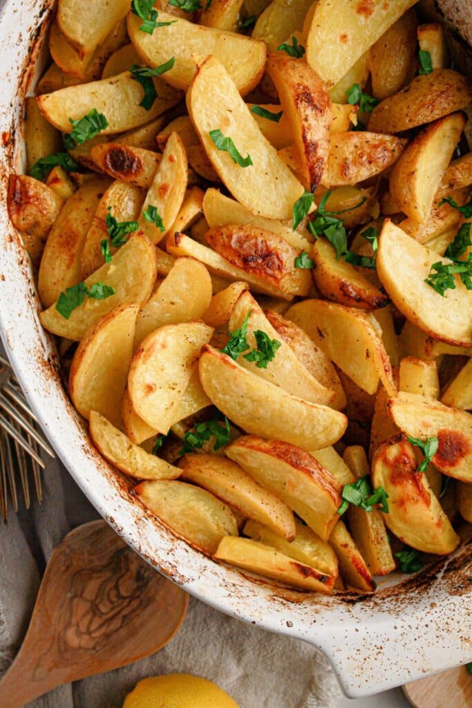 Roasted potatoes in a large baking dish.