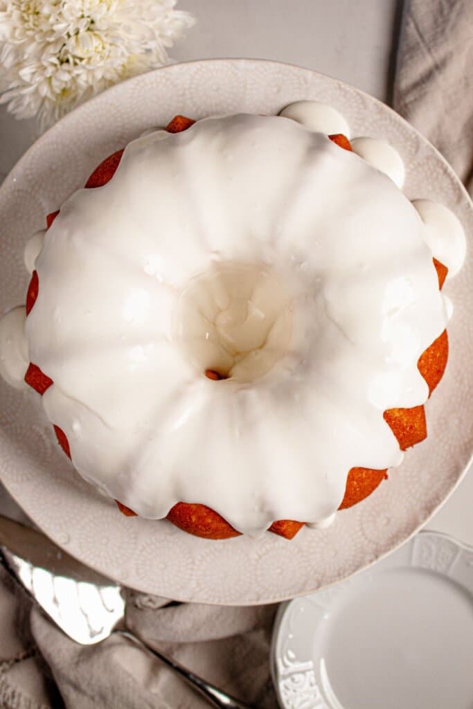 Lemon bundt cake on a cake stand.