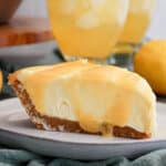 Slice of lemonade cream cheese pie on a plate.