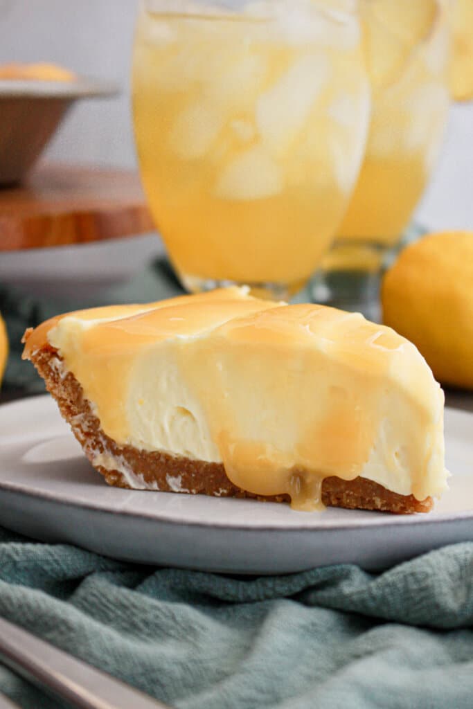Slice of lemonade cream cheese pie on a plate.