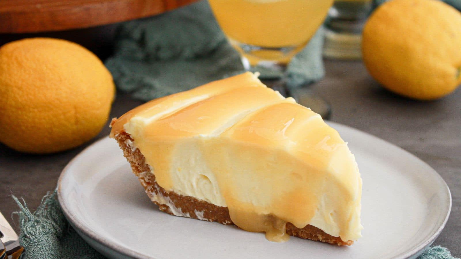 Slice of lemonade cream cheese pie on a plate.