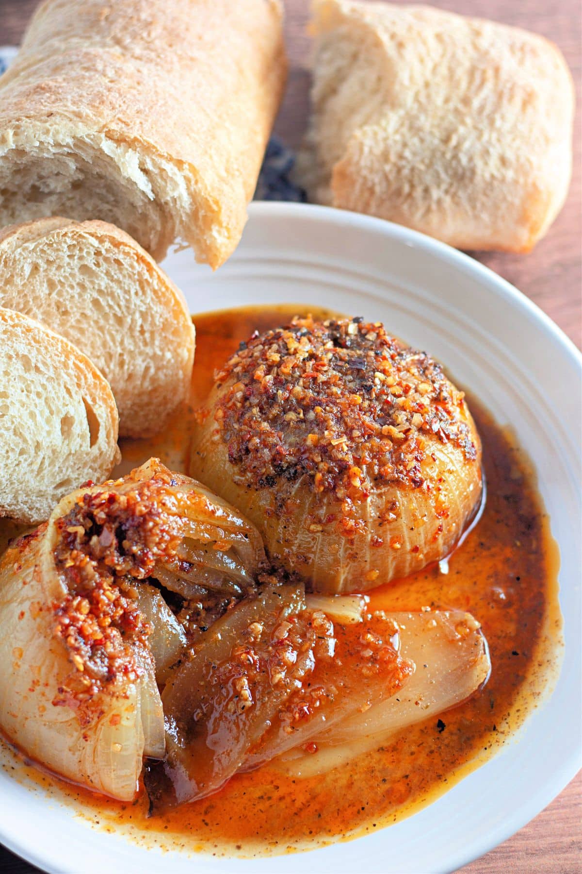 Onion boil in a white plate with slices of bread.