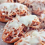 Spaghetti bread on a baking sheet.