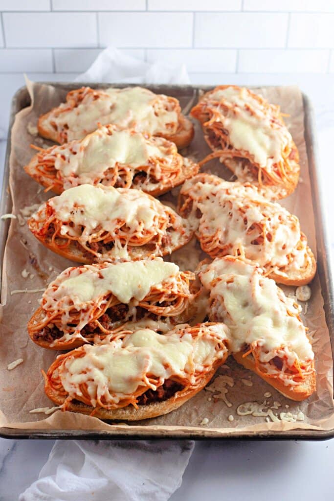 Spaghetti bread on a baking sheet.