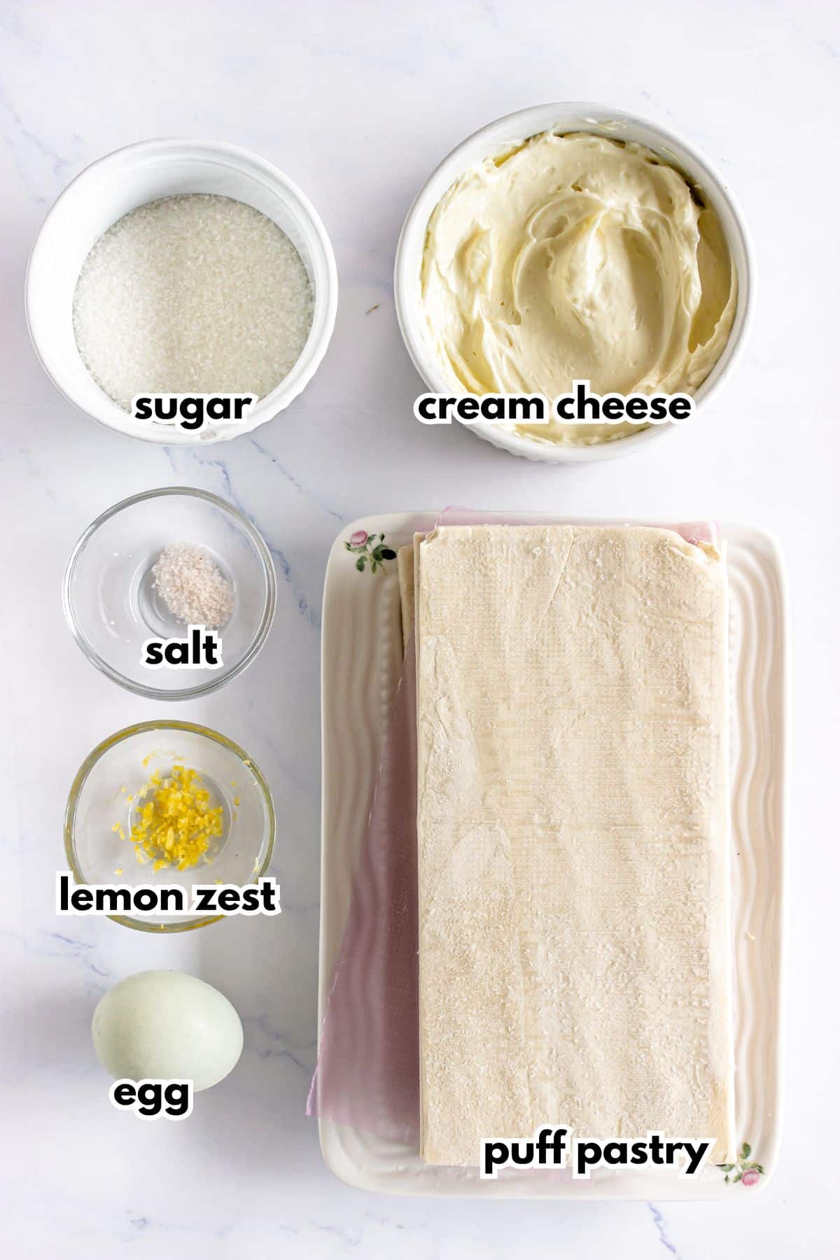 Bowls of ingredients on a counter labelled with text. Ready to cook.