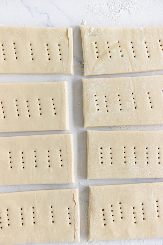 Holes being poked in a puff pastry.