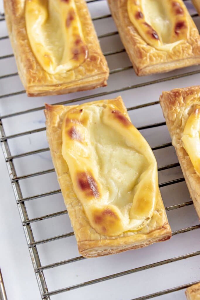 Starbucks cheese danish on a wire rack.