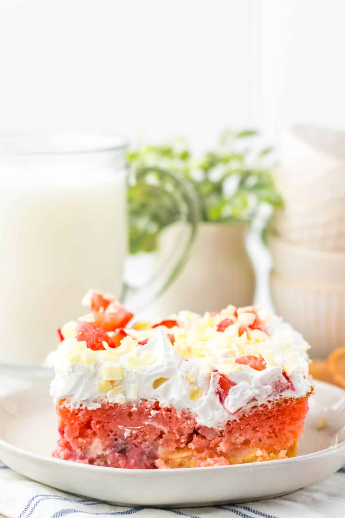Slice of strawberry earthquake cake on a plate.