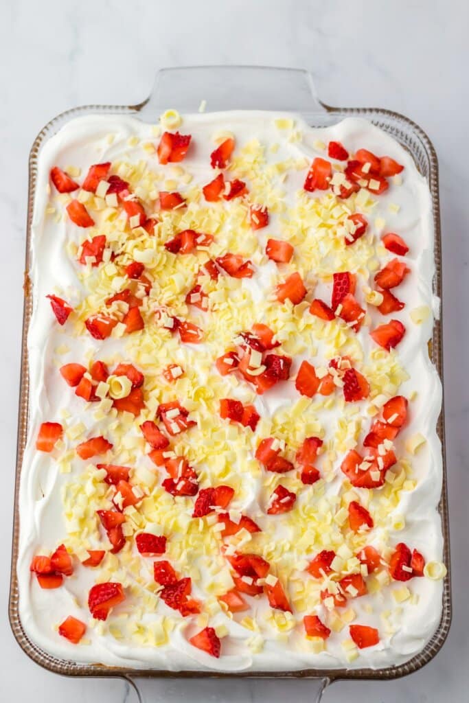 Glass baking dish full of strawberry earthquake cake.