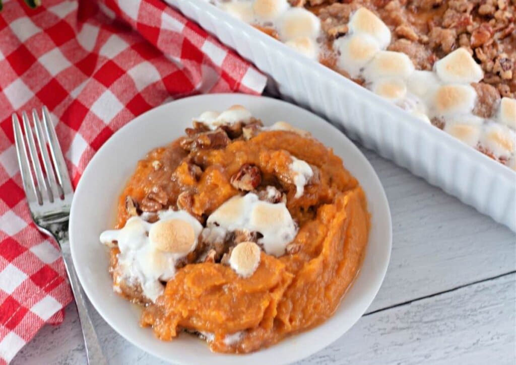White plate full of sweet potato casserole.