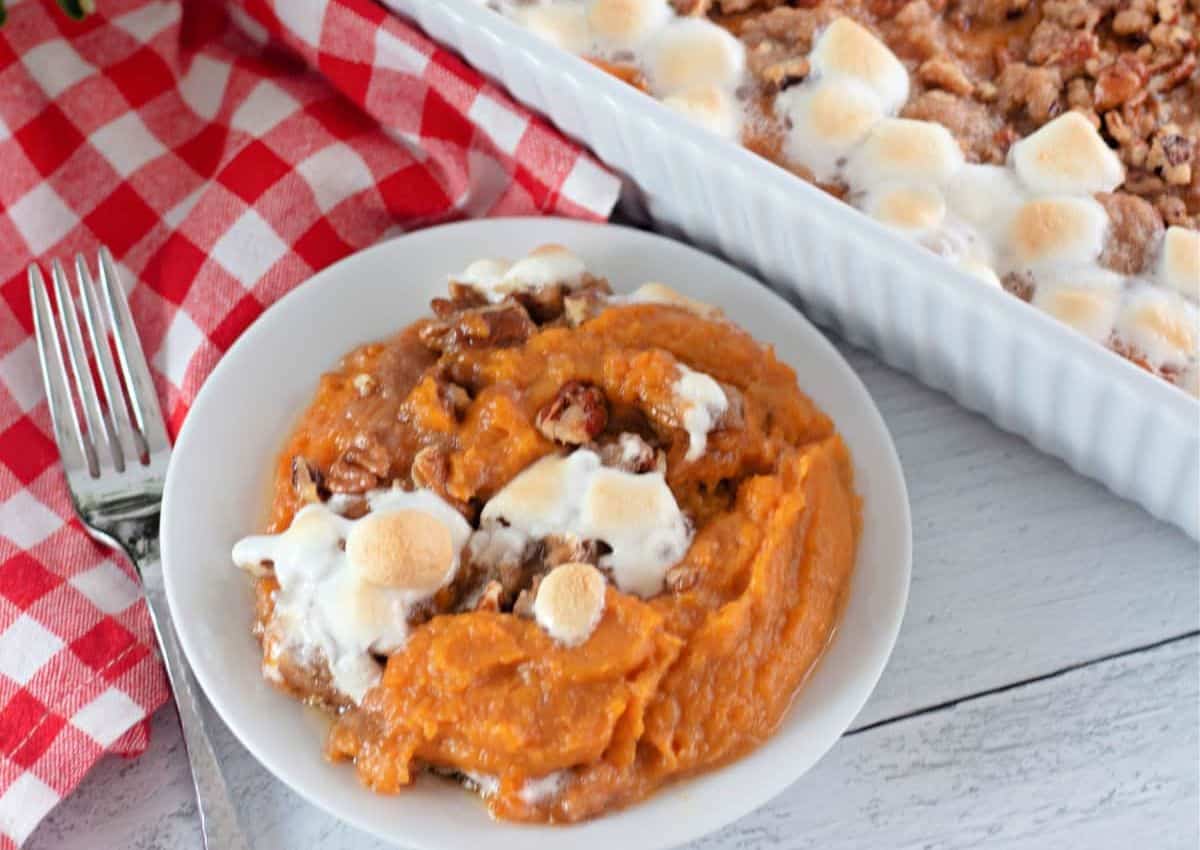 White plate full of sweet potato casserole.