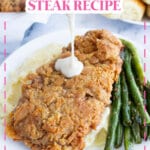 Chicken fried steak, green beans, and mashed potatoes on a plate.