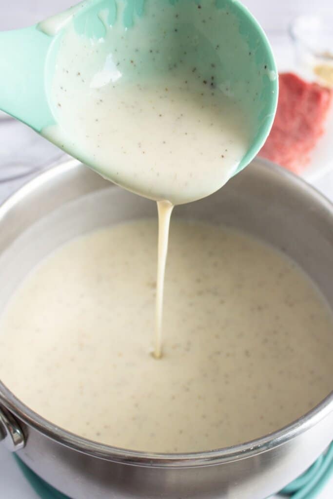 Gravy in a sauce pan on the stove.