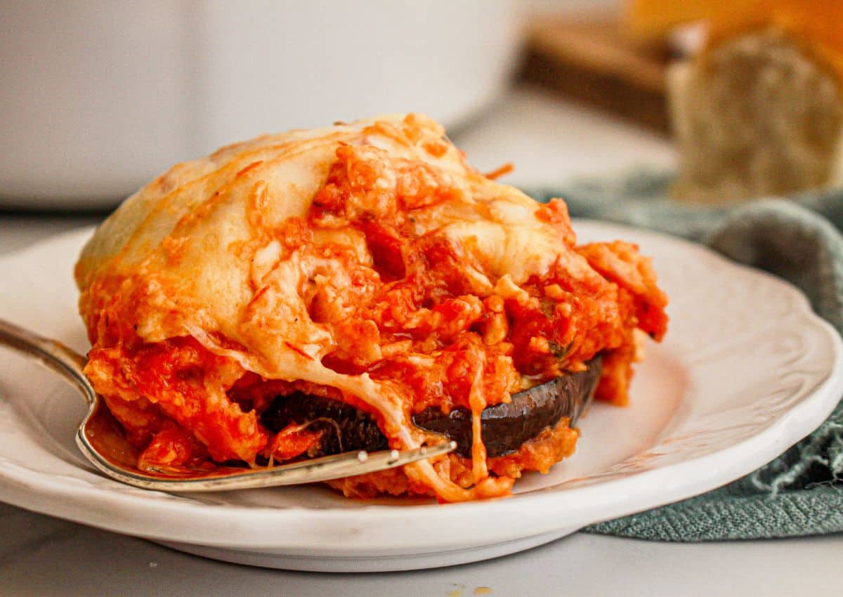 Serving of eggplant parmesan on a plate.