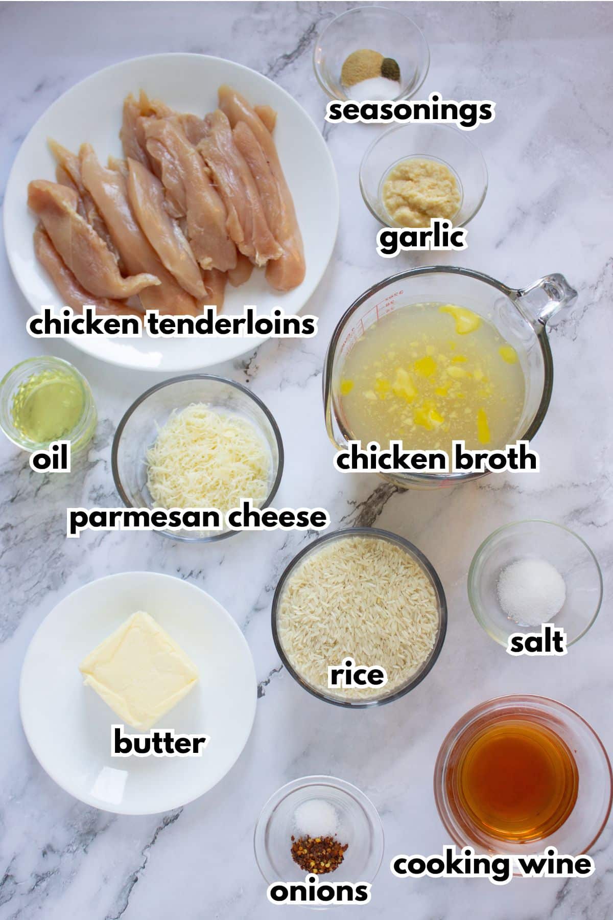 Bowls of ingredients labelled with text on a counter ready to cook.