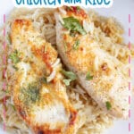 Plate full of rice with two chicken tenderloins on top.