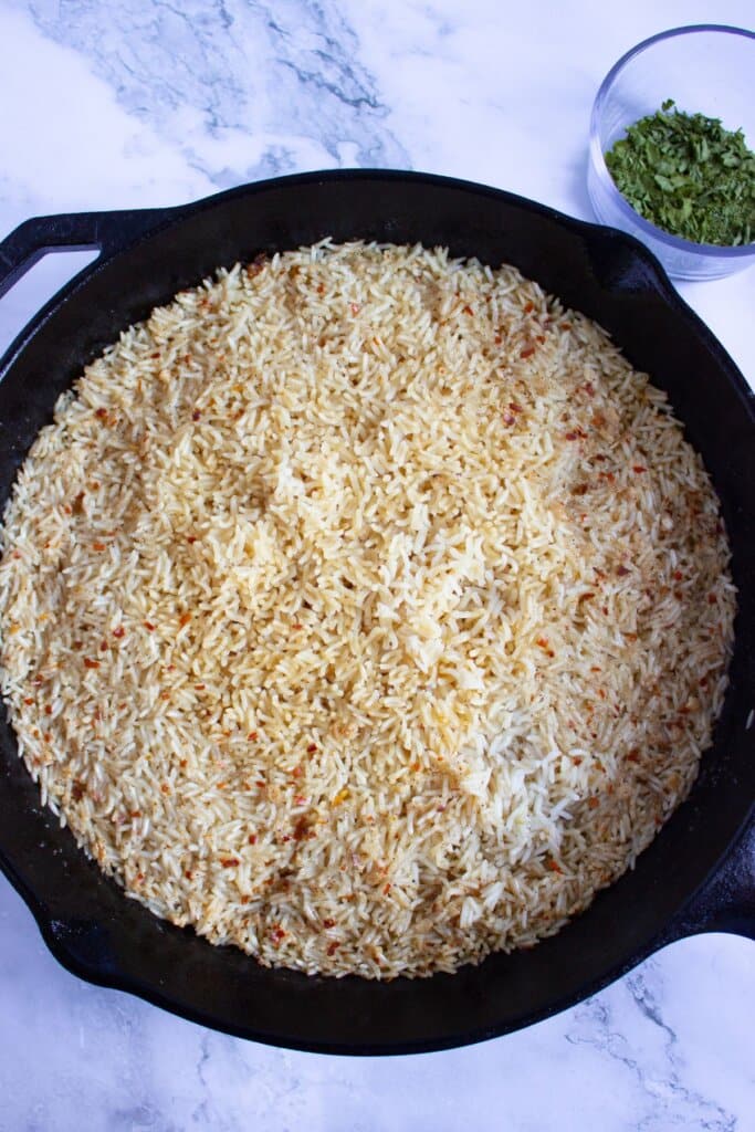 Rice cooked in a cast iron skillet.