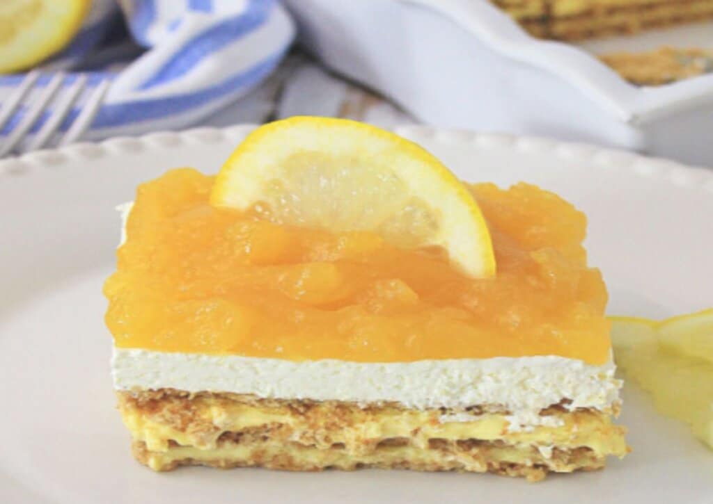 Slice of lemon icebox cake on a plate.